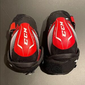 CCM Black and Red Protective Elbow Pads Size Child Large